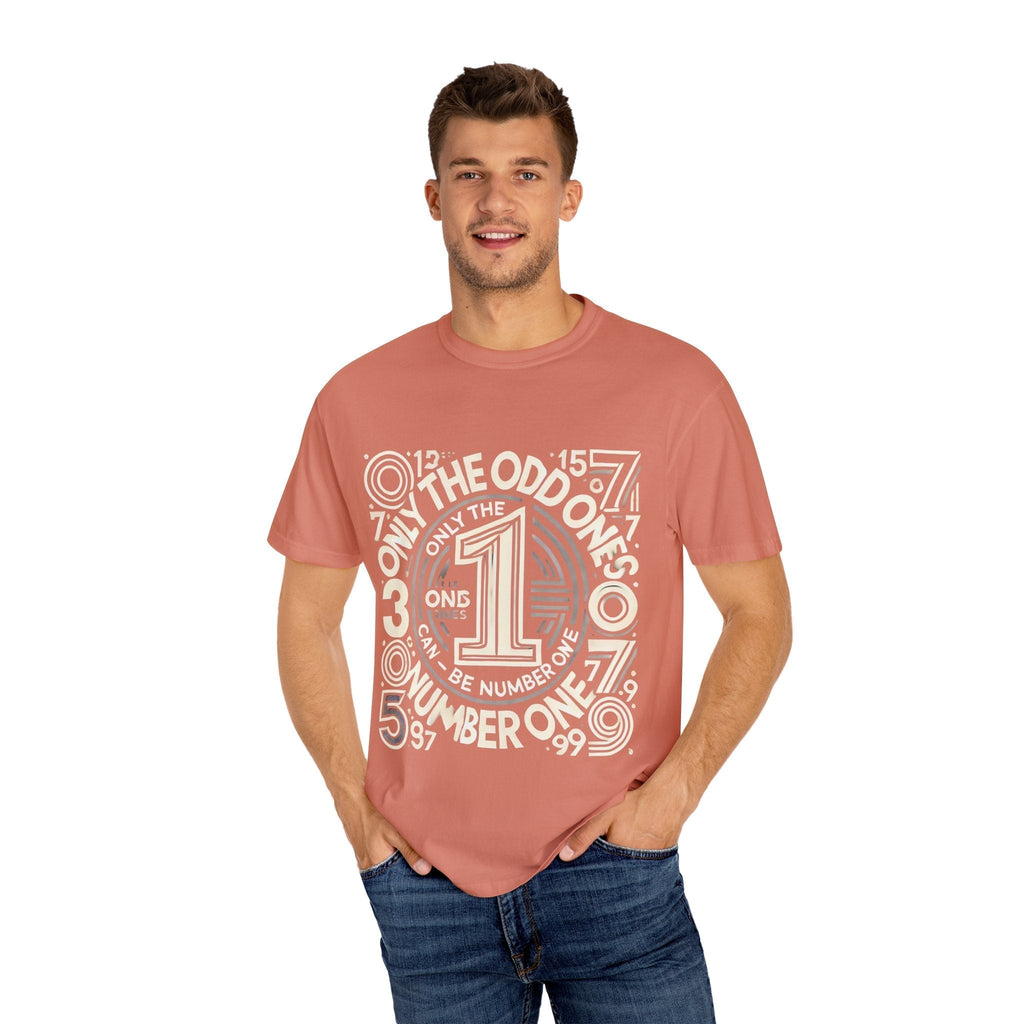 Unisex garment-dyed T-shirt with "Only the Odd Ones Can Be Number One" design, worn by a model.