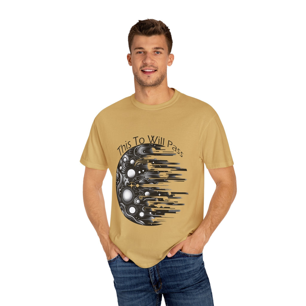 Unisex garment-dyed t-shirt with "This Too Will Pass" design, modeled by man wearing jeans.