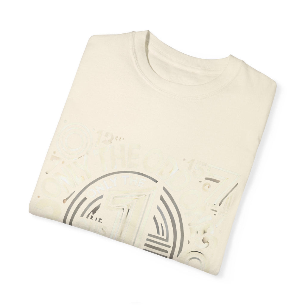 Unisex Garment-Dyed T-Shirt with unique design showcasing "Only the Odd Ones Can Be Number One," folded in soft fabric.