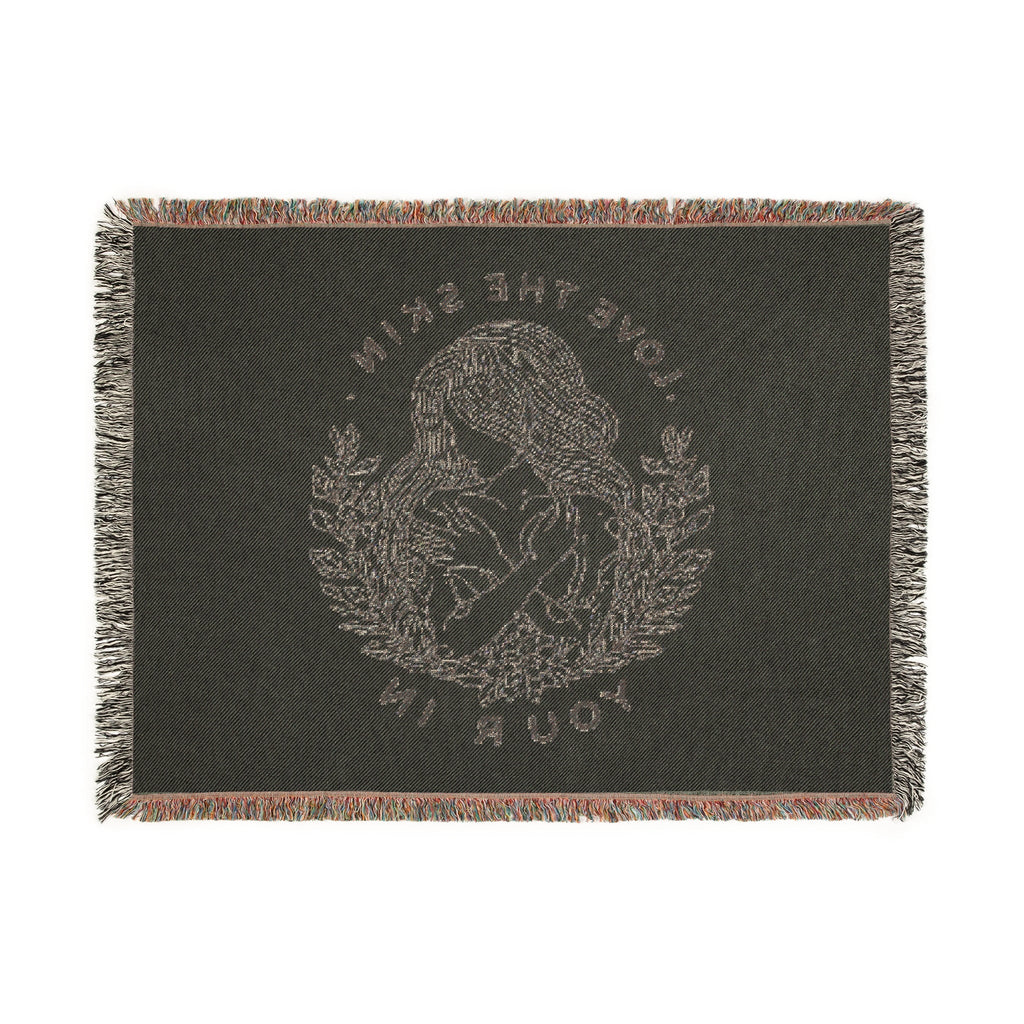 Serene Nature Woven Blanket with intricate nature-inspired design and colorful fringed edges.