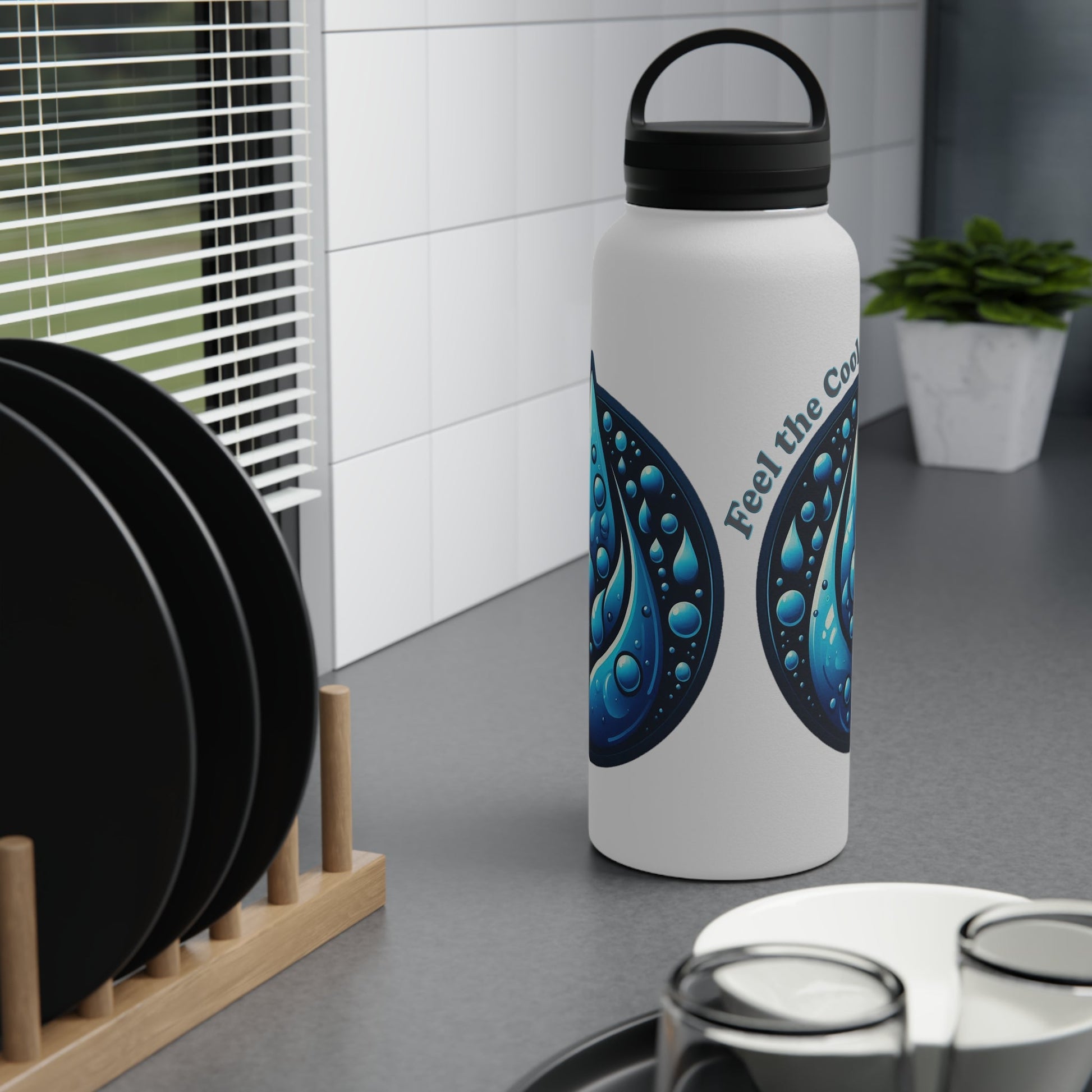 Blue Water Drop Stainless Steel Water Bottle on kitchen counter with comfortable handle lid.