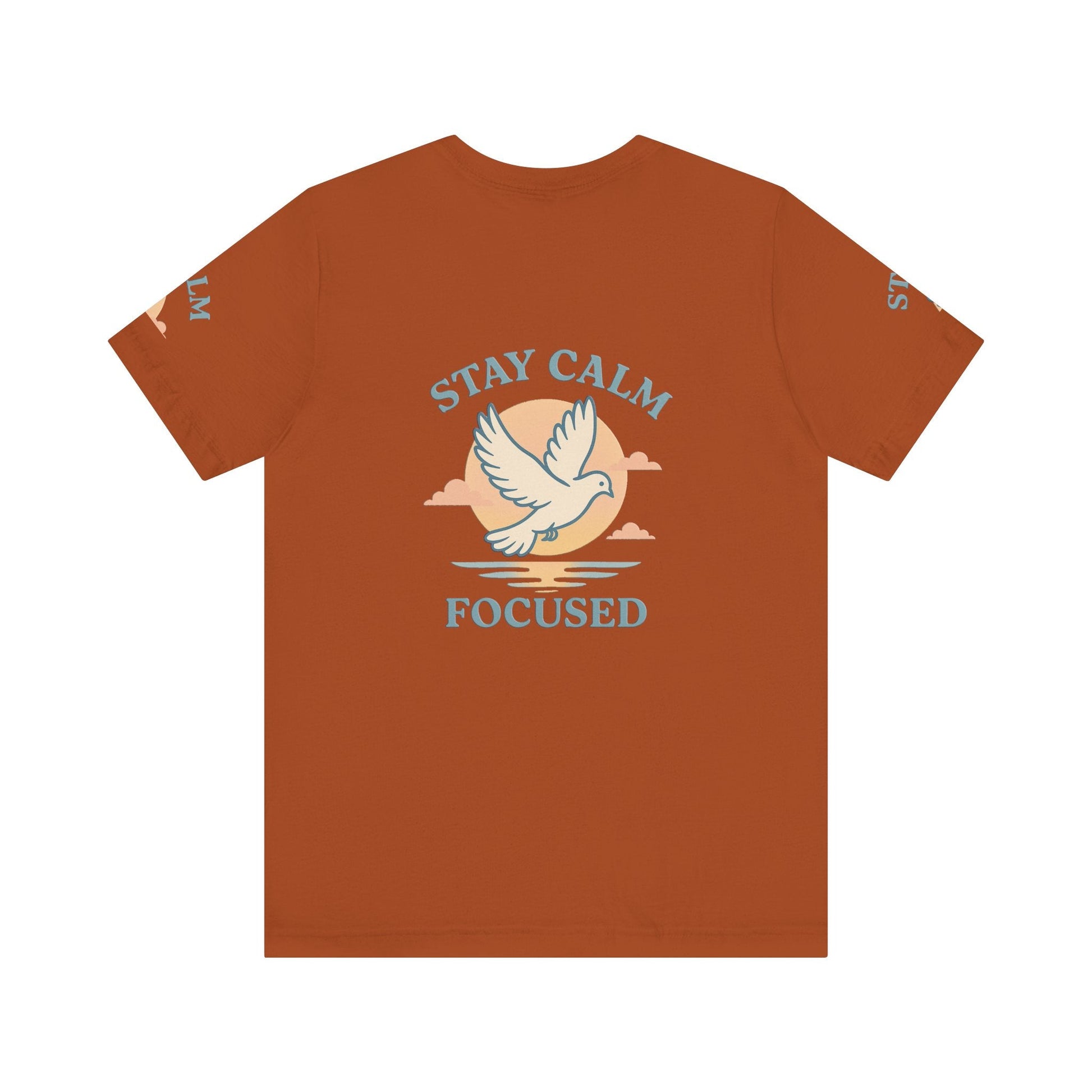 Unisex rust-colored T-shirt with "Stay Calm Focused" text and dove graphic, breathable cotton, motivational casual wear