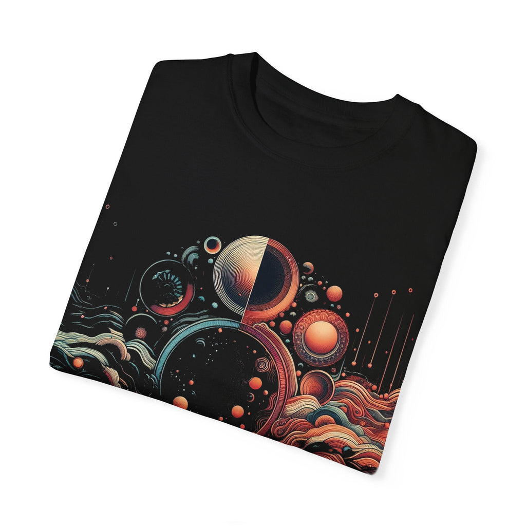 Cosmic Vibes Unisex Garment-Dyed T-Shirt folded with unique planet and wave design.