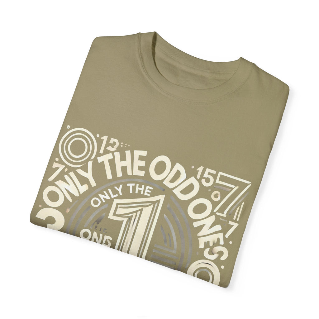 Unisex Garment-Dyed T-Shirt with "Only the Odd Ones Can Be Number One" graphic, folded in soft, unique color.