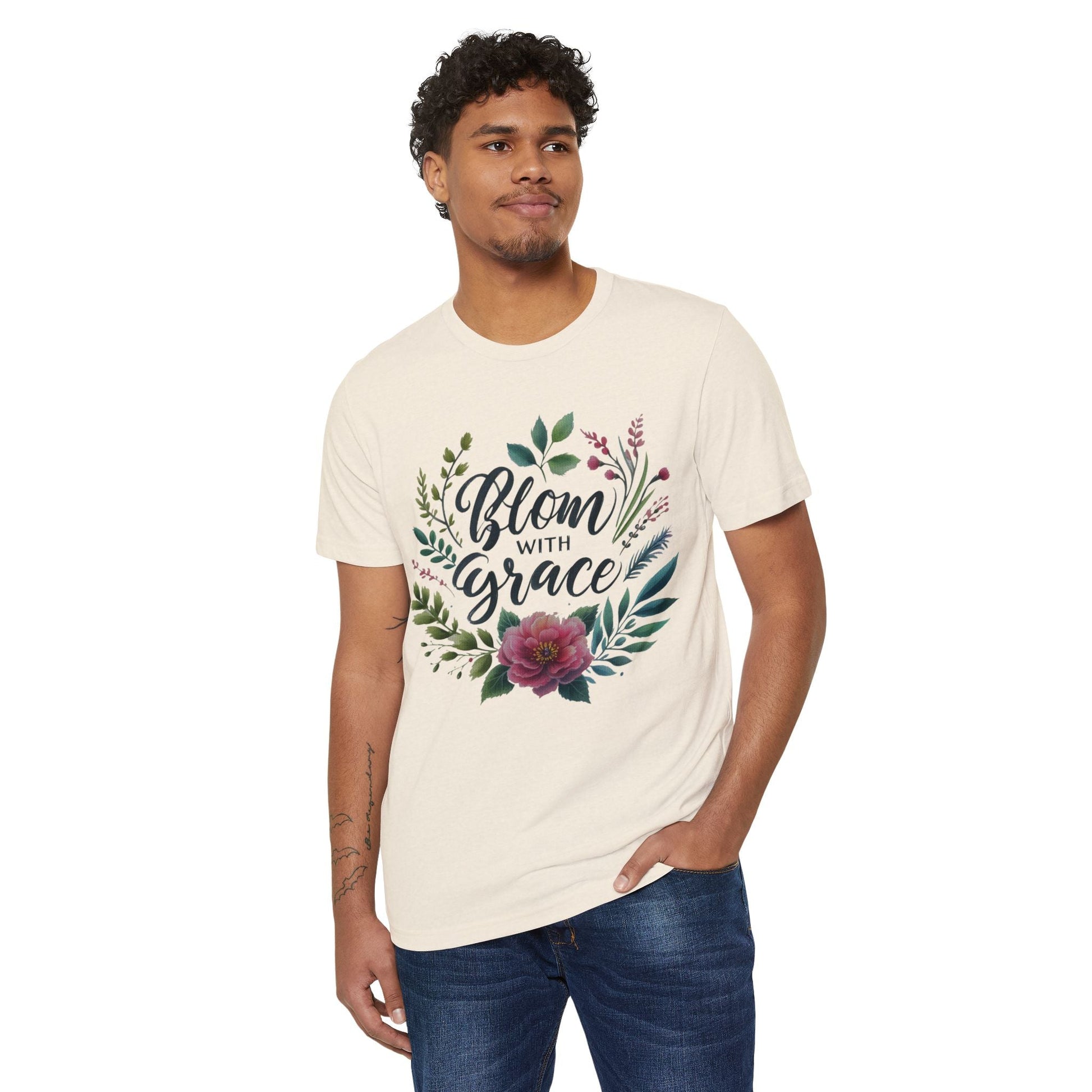 Eco-friendly organic t-shirt featuring "Bloom with Grace" floral design, high cut neckline, worn by a model.